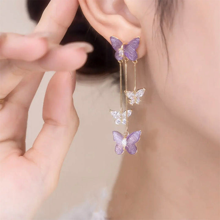 Elegant women's crystal butterfly earrings with a gracefully flowing tassel, perfect for evenings