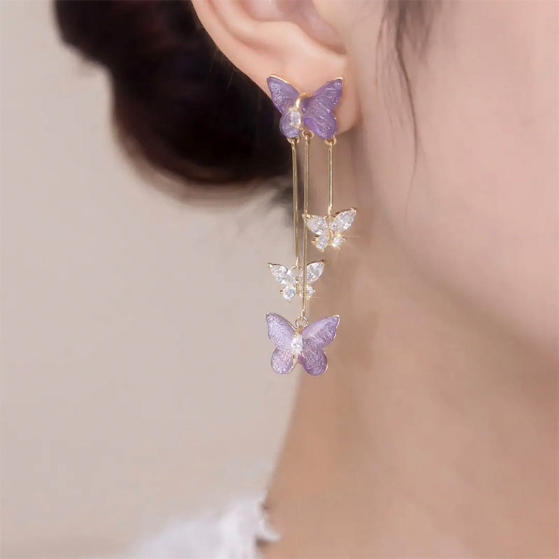Front view of women's crystal butterfly tassel dangle earrings, highlighting gemstone brilliance