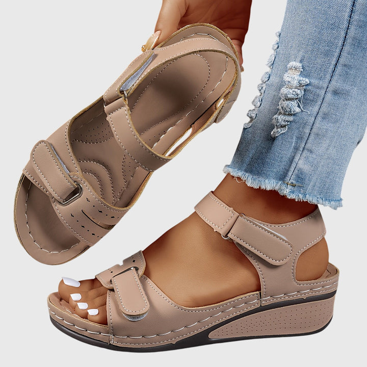 Stylish women's slip-on sandals with dazzling crystals, designed for orthopedic arch support and comfort.