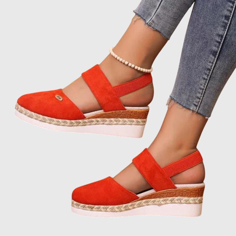Woman wearing comfortable orthopedic sandals, showcasing foot health & pain relief for everyday walking.