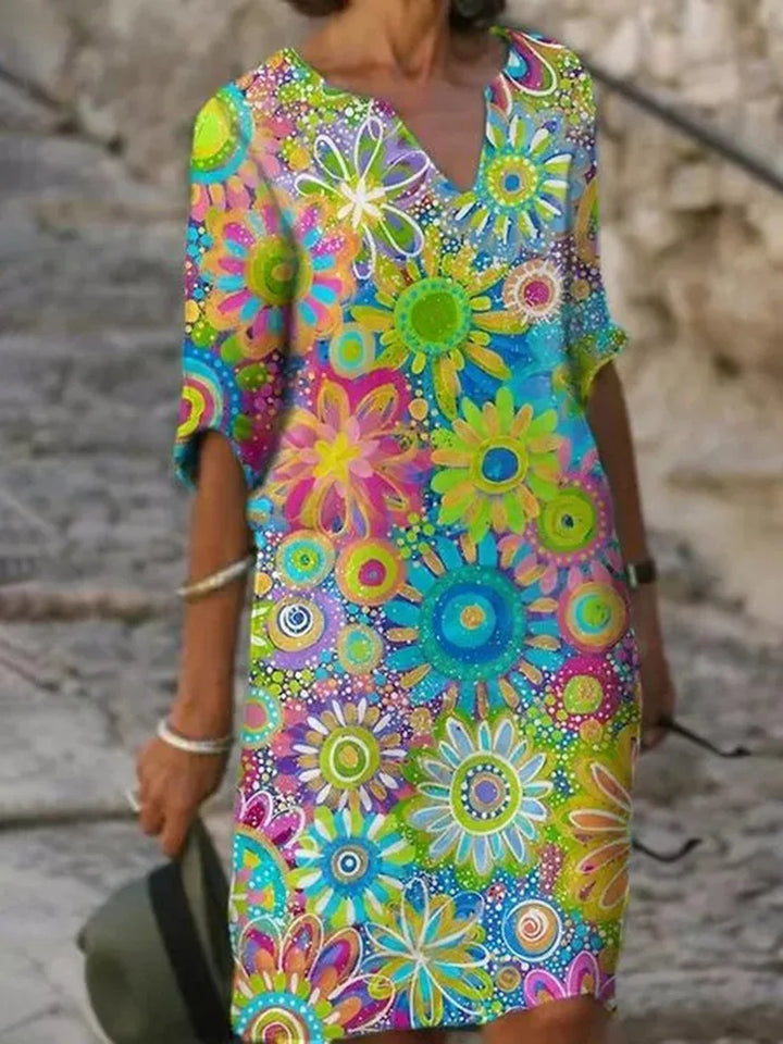 Elegant women's boho V-neck summer dress with abstract dahlia floral print. Ideal for beach, casual outings.