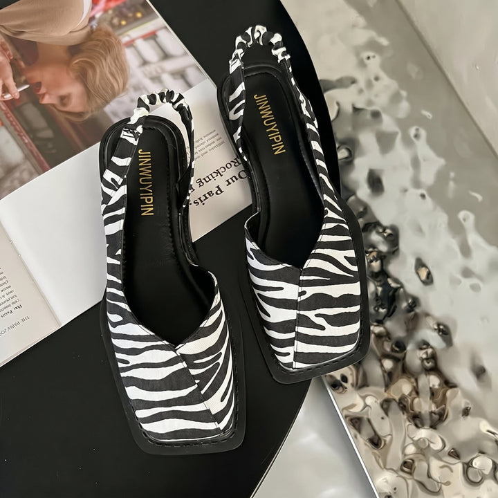 Stylish women's Daisy block heel slingback sandals, modern square toe design. Chic and versatile summer footwear.