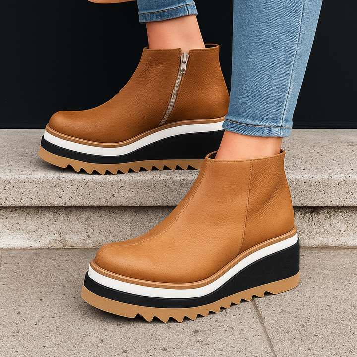 Close-up of women's dark brown platform ankle boots showcasing the orthopedic insole and textured material.