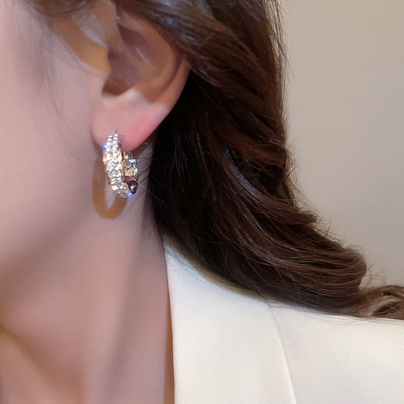 Front view of women's dazzling small hoop earrings, showcasing brilliant rhinestone details