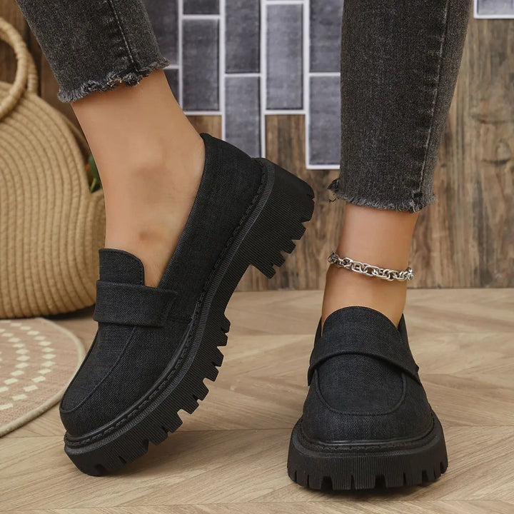 Detail of orthopedic insole within women's denim platform loafers, ensuring all-day comfort