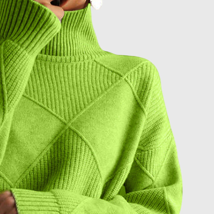 Oversized women's roll neck sweater, warm knit, diagonal seam, ideal for cozy winter fashion.