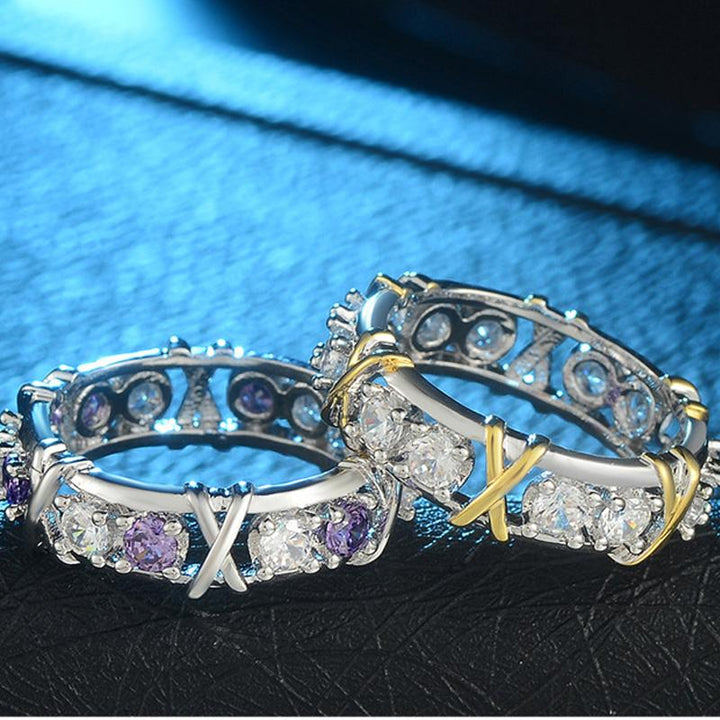 Side view of a women's dichroic zircon ring, showcasing details