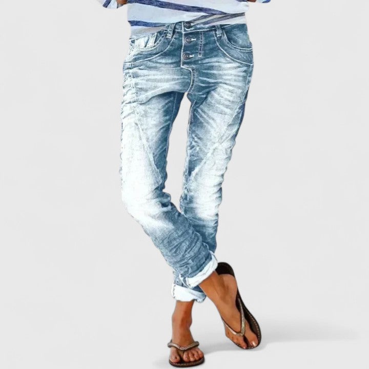 Fashionable women's distressed wide leg jeans, featuring a relaxed fit & classic vintage denim style.