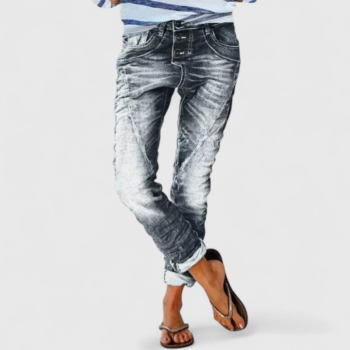 Front view of women's vintage style distressed wide leg jeans, showing relaxed fit & mid-rise design.
