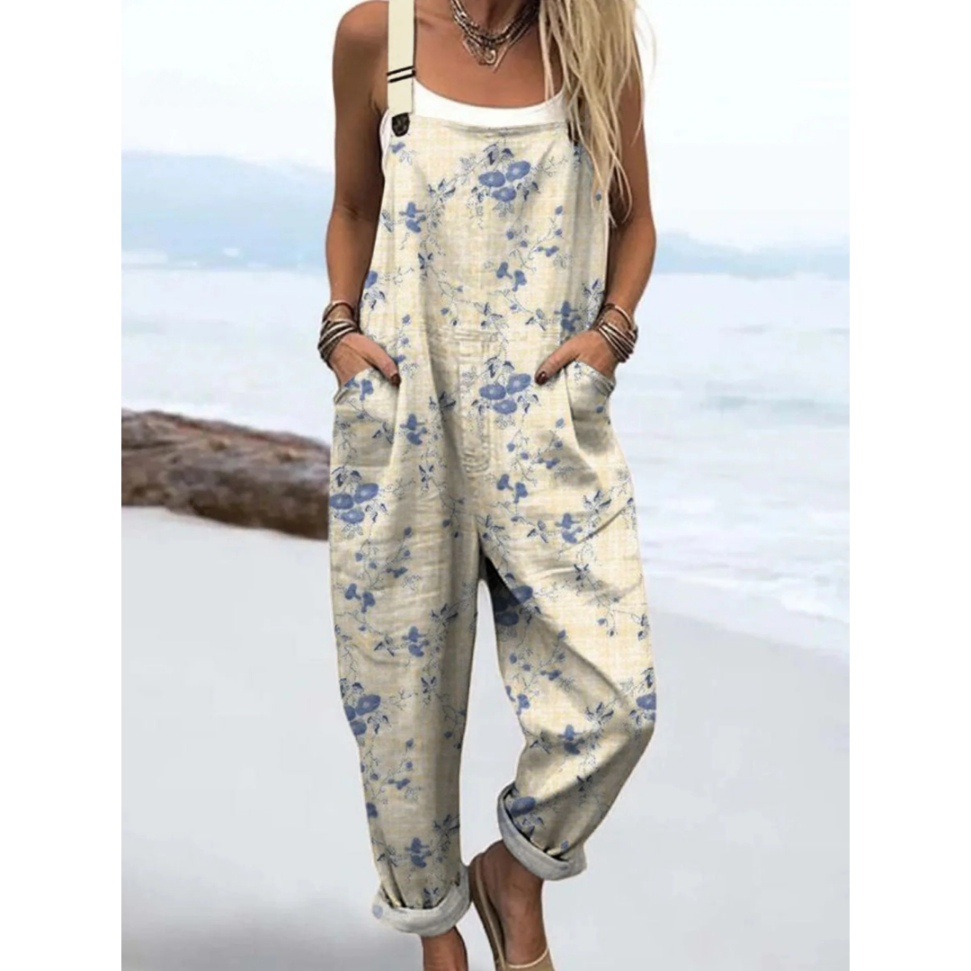 Women's ditsy floral boho jumpsuit with adjustable straps & pockets, ideal for summer casual wear.