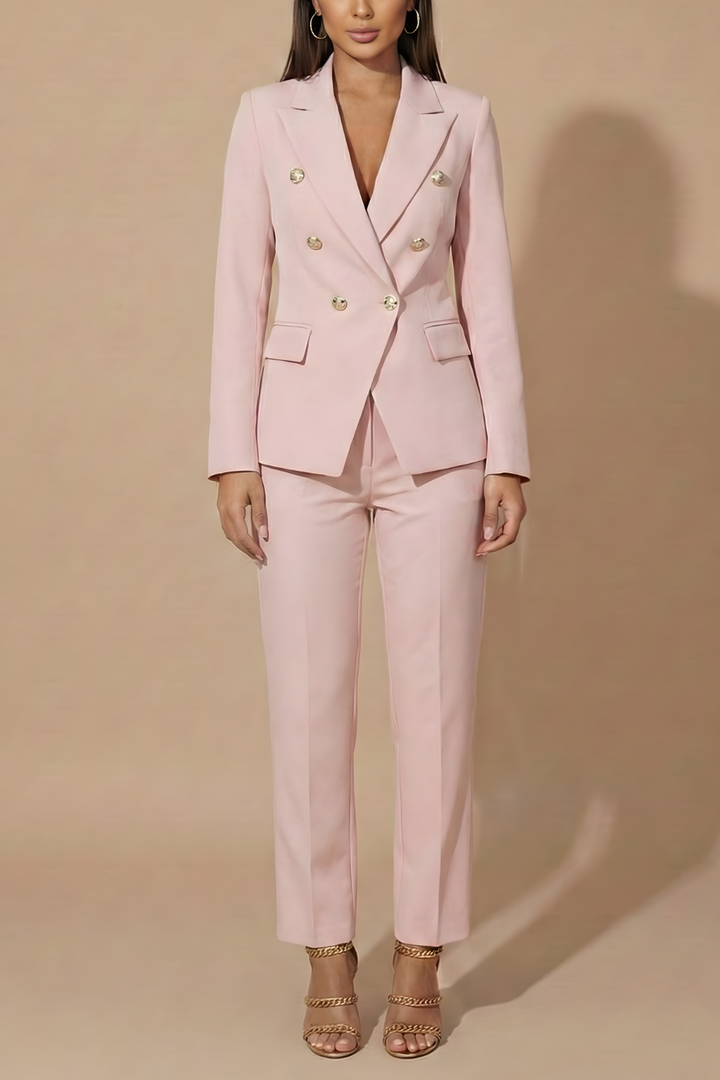 Assertive women's power suit featuring a double-breasted blazer and tailored trousers for formal business.