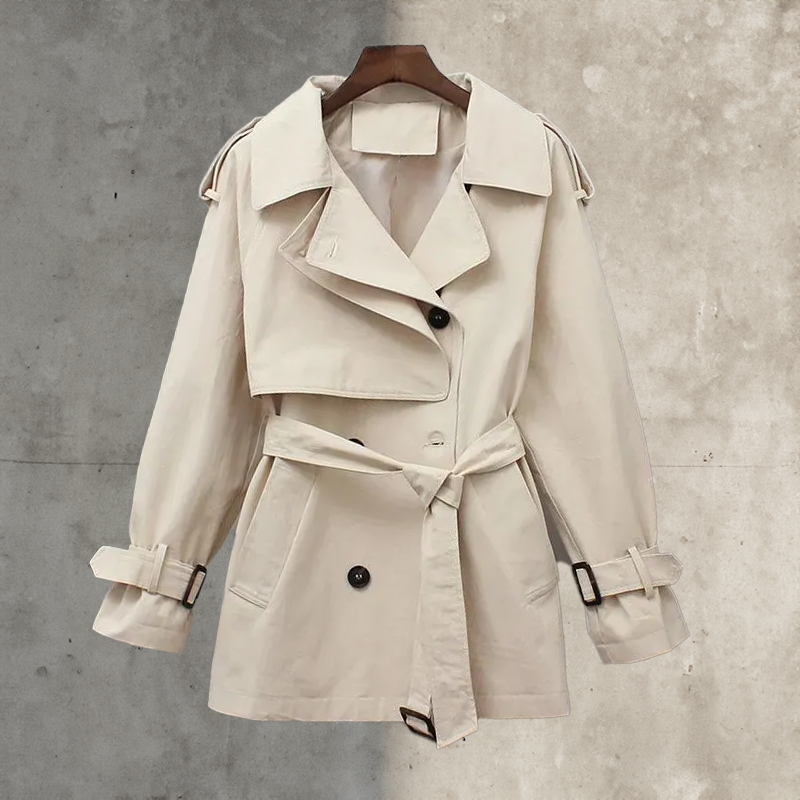 Classic women's double-breasted trench coat with a belt. Stylish long spring/fall jacket, ideal for elegant workwear.