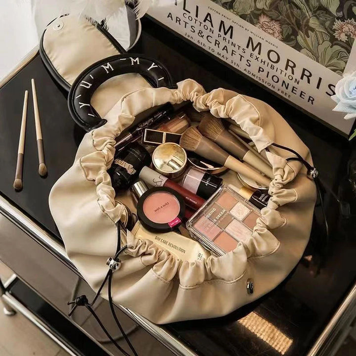 Faux leather cosmetic organizer handbag with drawstring, flat lay, empty inside