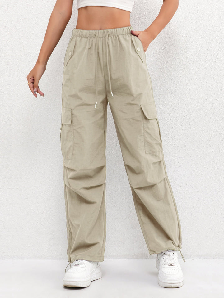 Fashionable women's cargo parachute pants with a comfy drawstring waist, offering a trendy and relaxed everyday look.