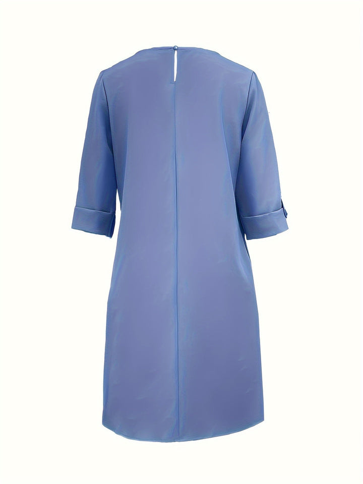 Comfortable women's versatile midi dress, suitable for autumn. Features a flattering shift fit and three-quarter sleeves.