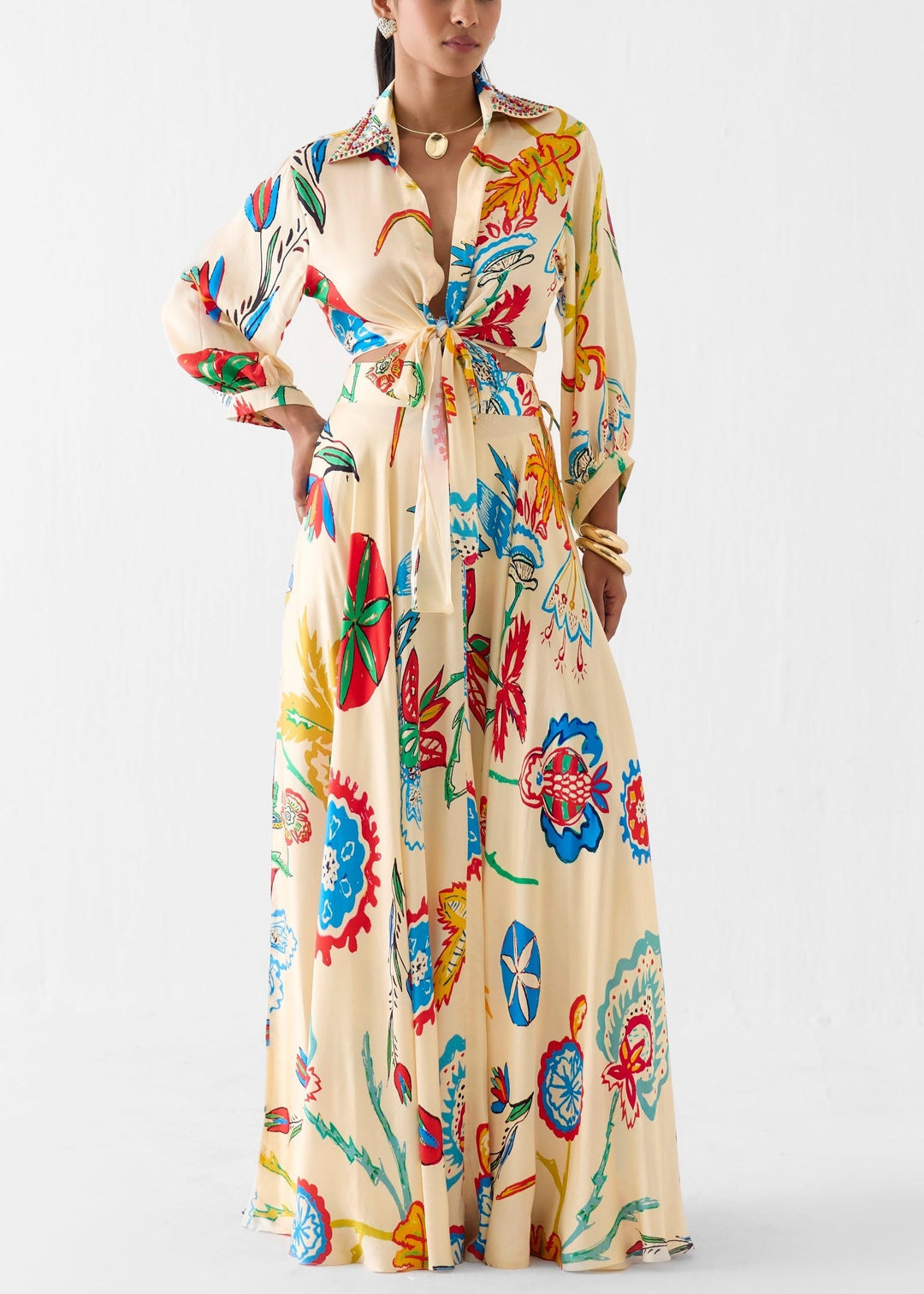 Women's effortless beige floral two-piece set featuring a tie-front shirt and a flowing maxi skirt.
