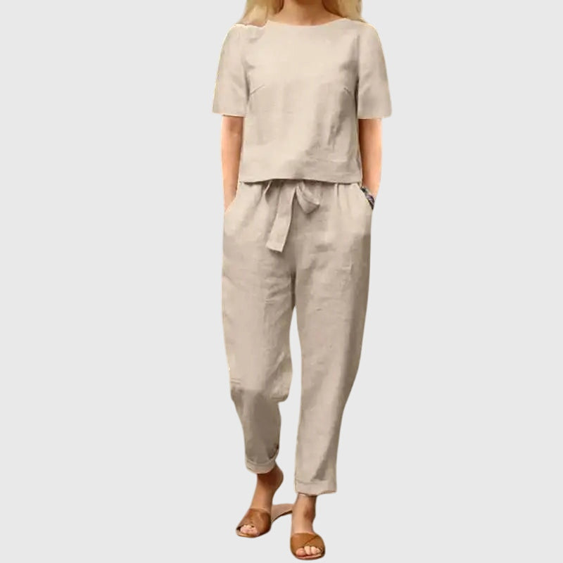 Stylish women's co-ord set with a belted crop top and flowy trousers, ideal for warm weather fashion.