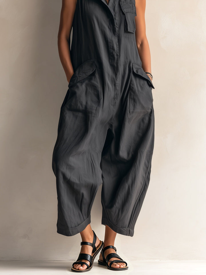Modern black sleeveless jumpsuit featuring a chic collar and trendy wide leg silhouette, a versatile women's outfit.