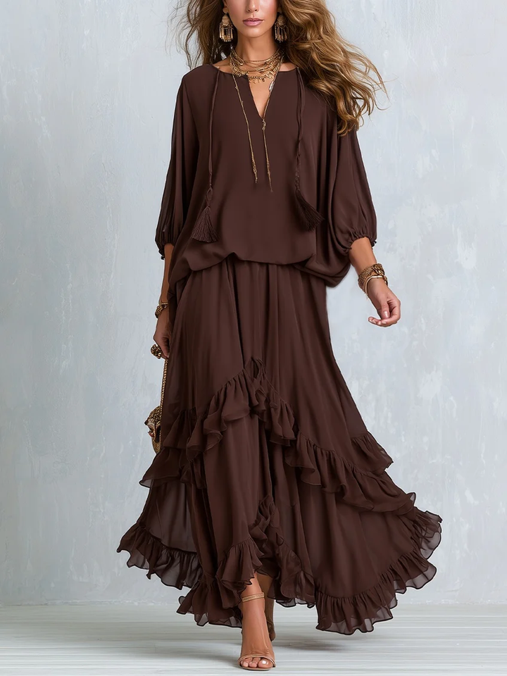 Women's effortless brown V-neck wrap maxi dress with elegant ruffle hem & long sleeves, ideal for autumn fashion.