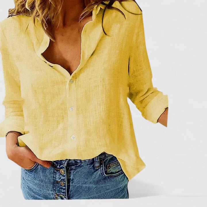 Sophisticated women's blouse, button-down front, soft lapel collar, suitable for work.