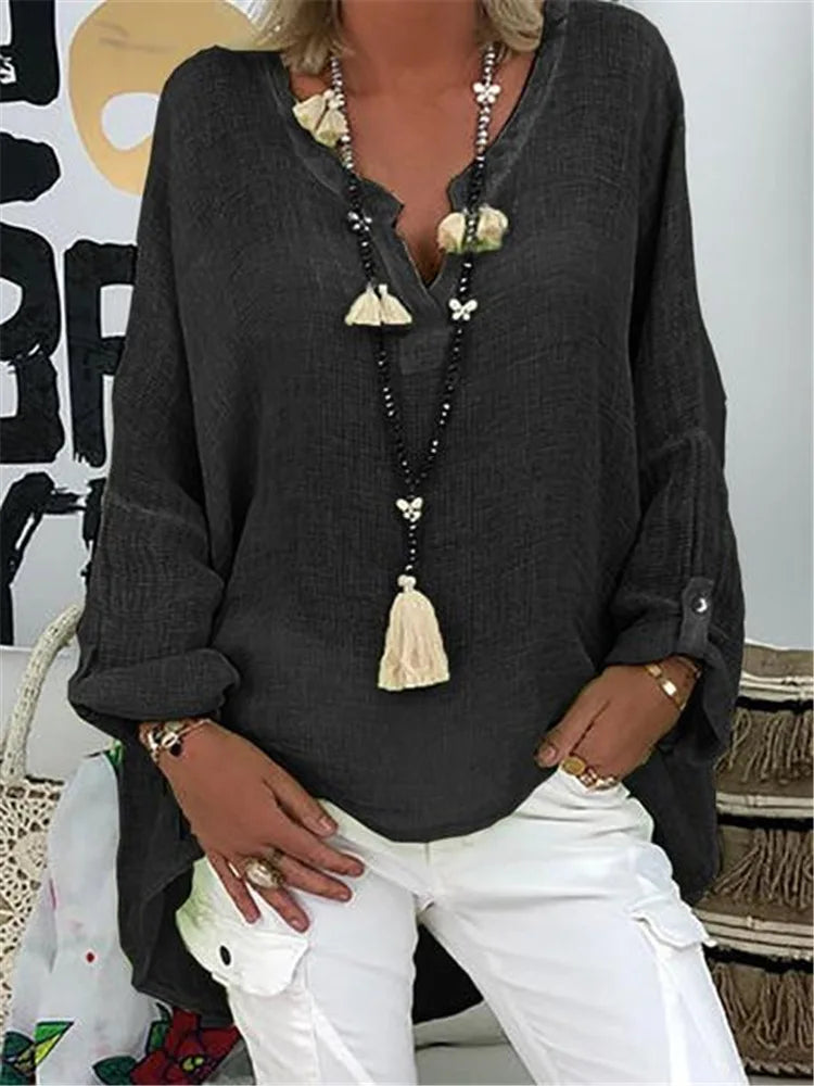 Stylish women's oversized blouse with a relaxed fit, offering chic comfort for everyday and summer fashion.