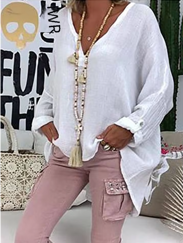 Effortless chic oversized women's top, a versatile blouse for relaxed summer style and contemporary fashion.
