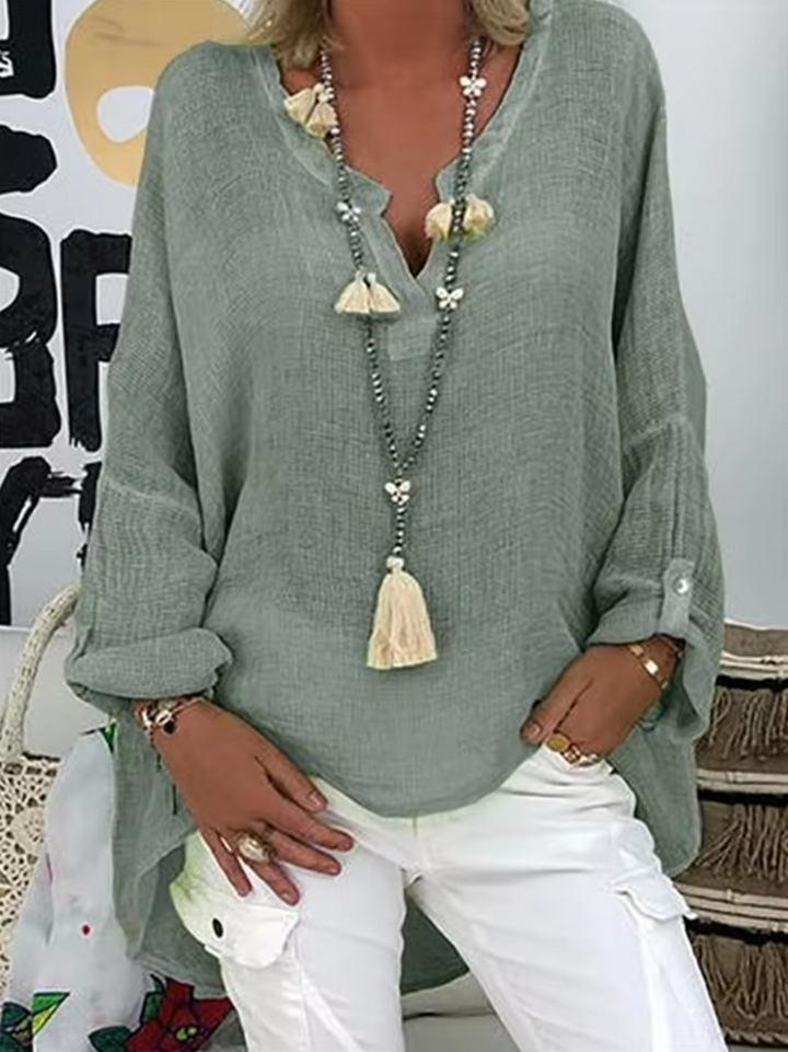 Relaxed fit women's chic oversized top, a comfortable and stylish blouse for versatile summer fashion.