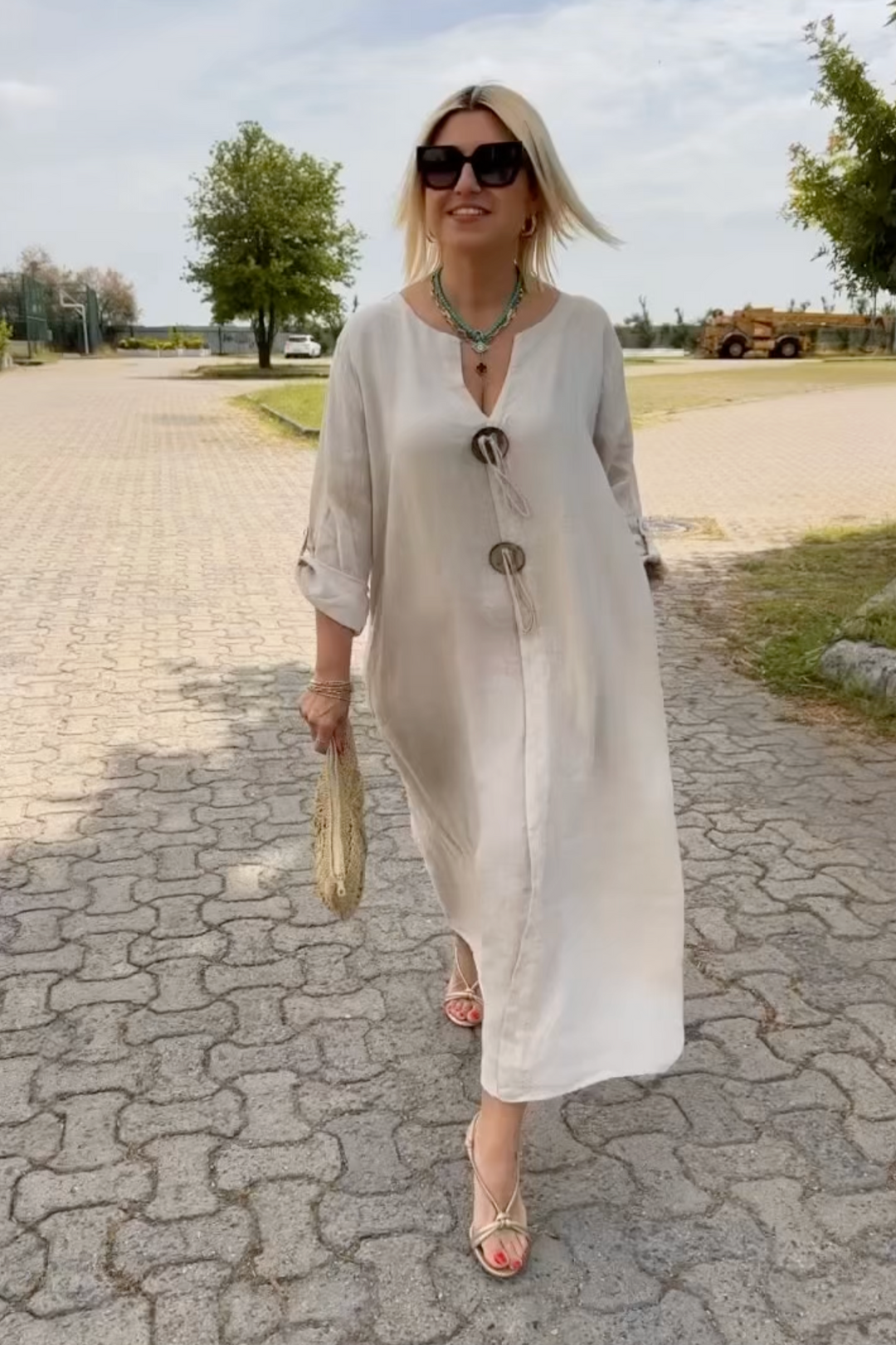 Beige women's relaxed fit tunic dress, an effortless chic and comfortable summer style for versatile everyday wear.