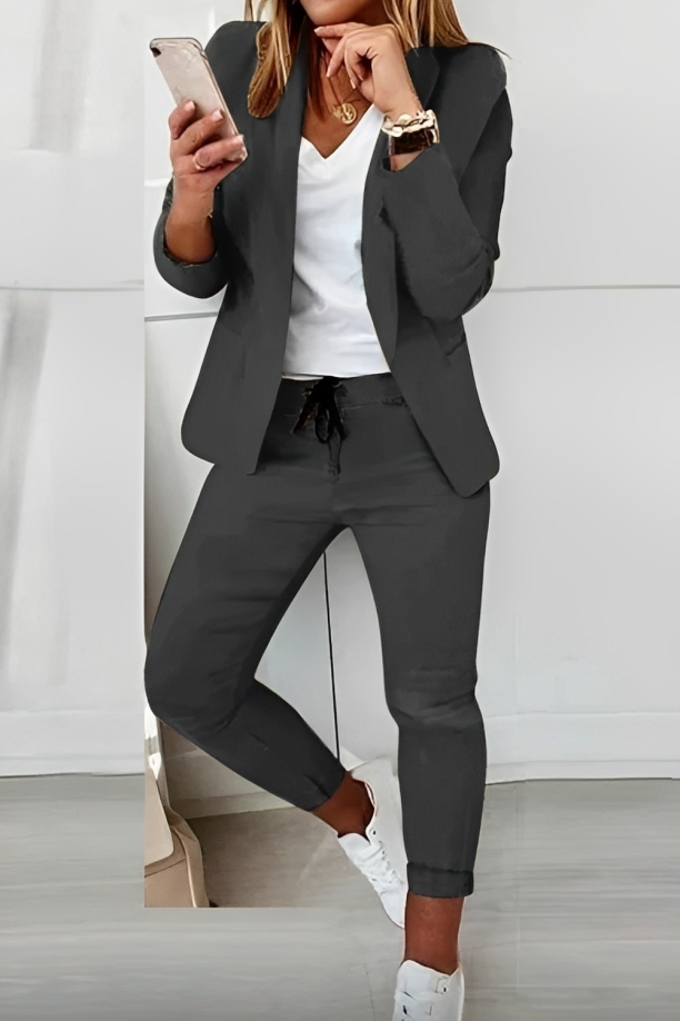 Women's effortless chic two-piece suit set with modern blazer & pants. Perfect for professional or casual wear.