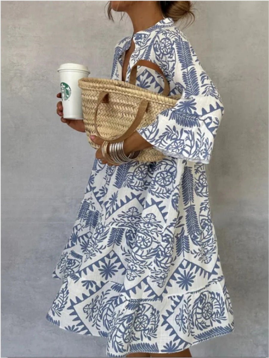 Effortless women's boho sundress with a breezy floral print and elegant tiered skirt, great for summer fashion.