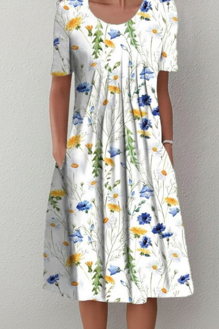 Easy slip-on women's knee-length floral dress. Everyday casual summer style, comfortable and with pockets.