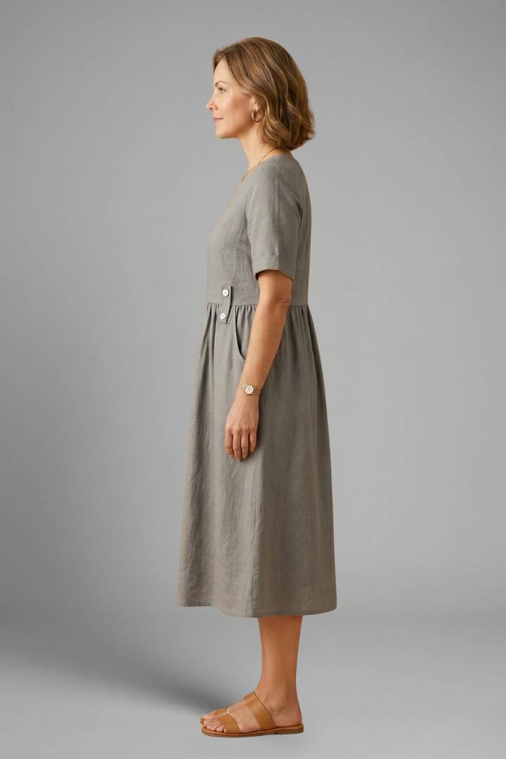 Stylish women's midi dress with a simple round neck, short sleeves, and a comfortable loose fit.