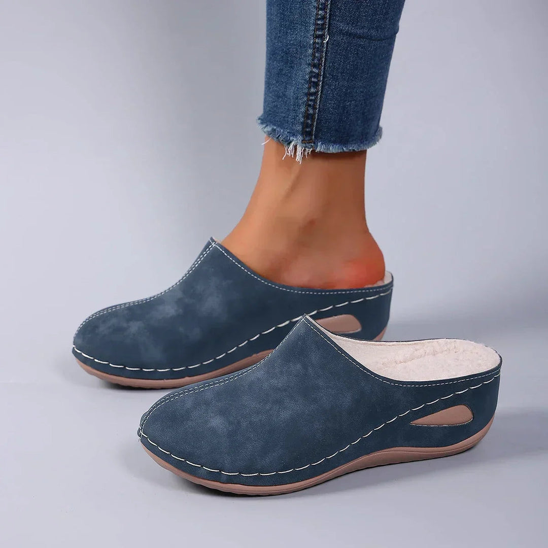 Lightweight women's slip-on comfort clogs with cushioning for everyday indoor-outdoor wear.