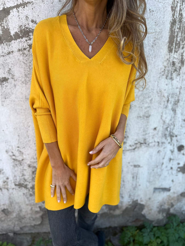 Versatile women's swing V-neck tunic pullover sweater. Relaxed fit, long sleeve for effortless casual style.