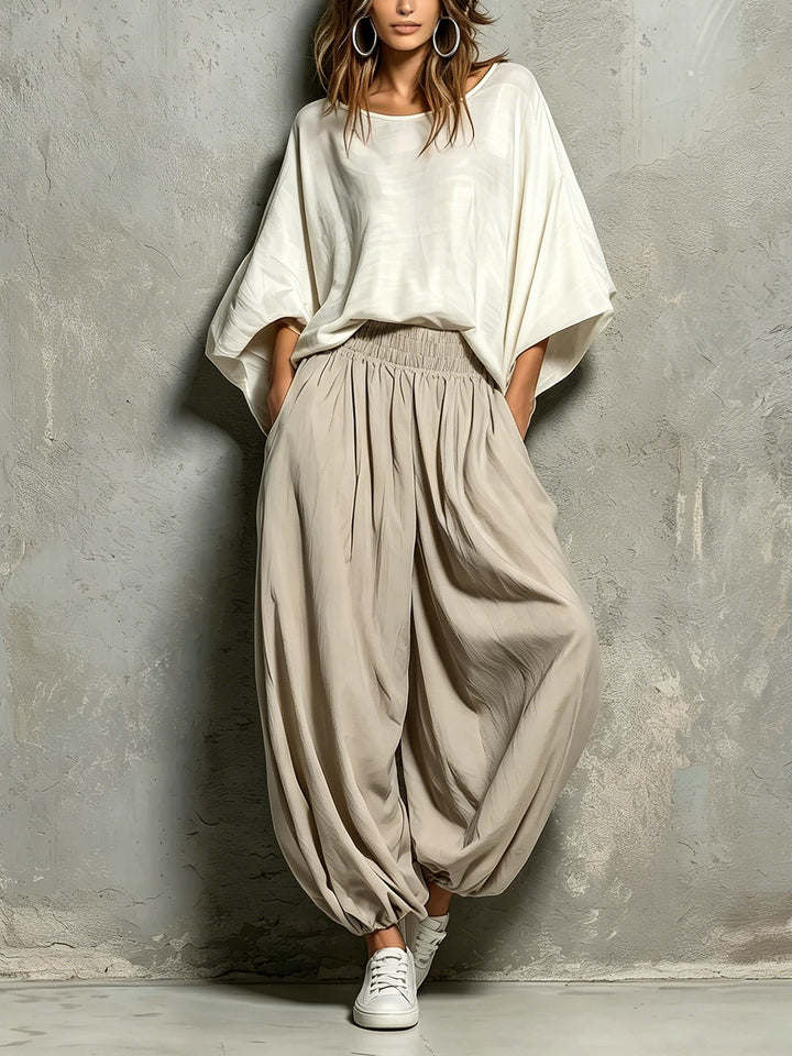 Women's effortless taupe wide leg harem pants with a comfortable drawstring waist, perfect for casual wear.