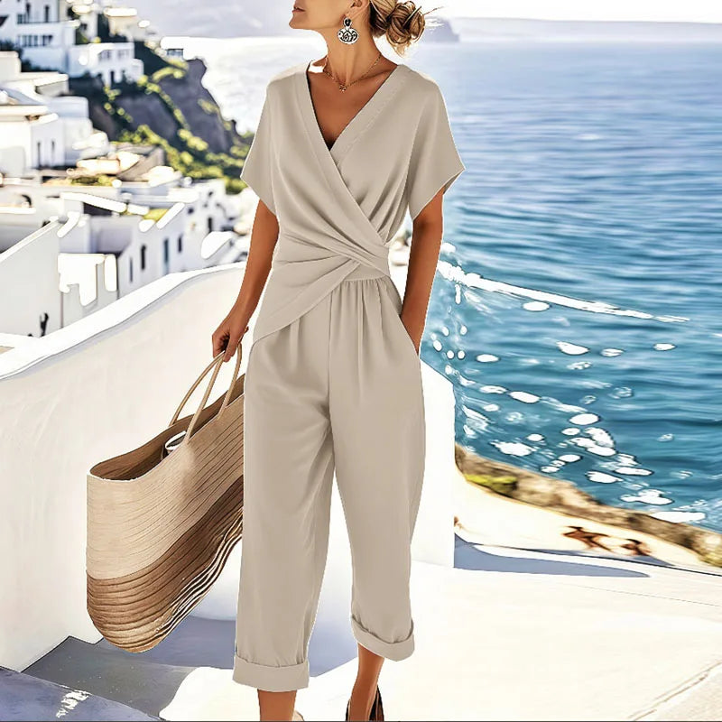 Women's effortless two-piece set with a flattering V-neck wrap top & high-waisted cropped pants. Chic spring/summer outfit.
