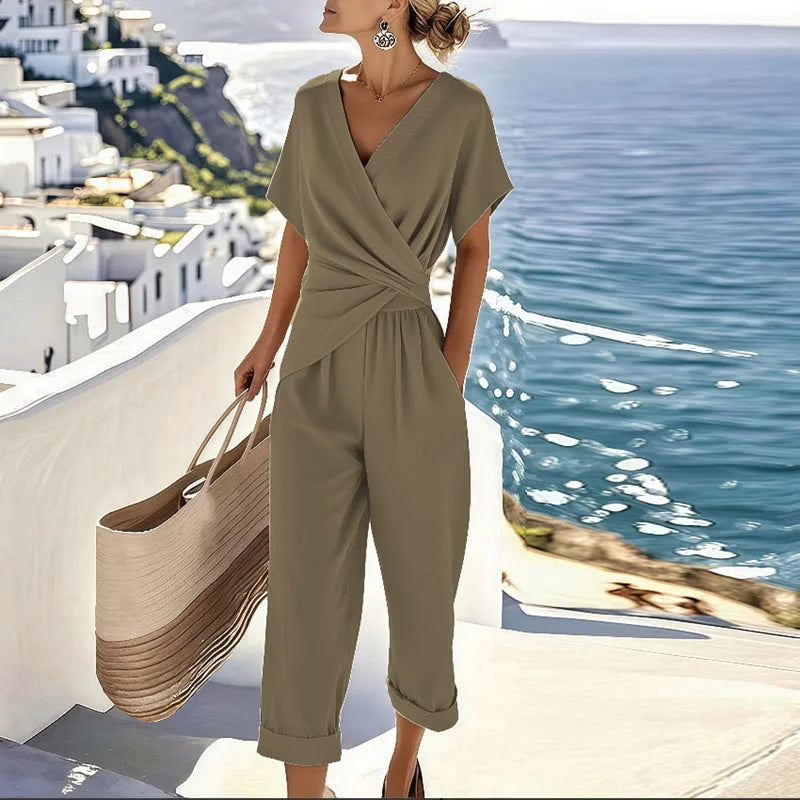 Flattering women's two-piece outfit featuring a stylish wrap V-neck top & comfortable cropped pants. Casual spring fashion.