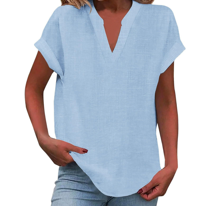 Relaxed fit V-neck tunic blouse, versatile for casual summer outfits.
