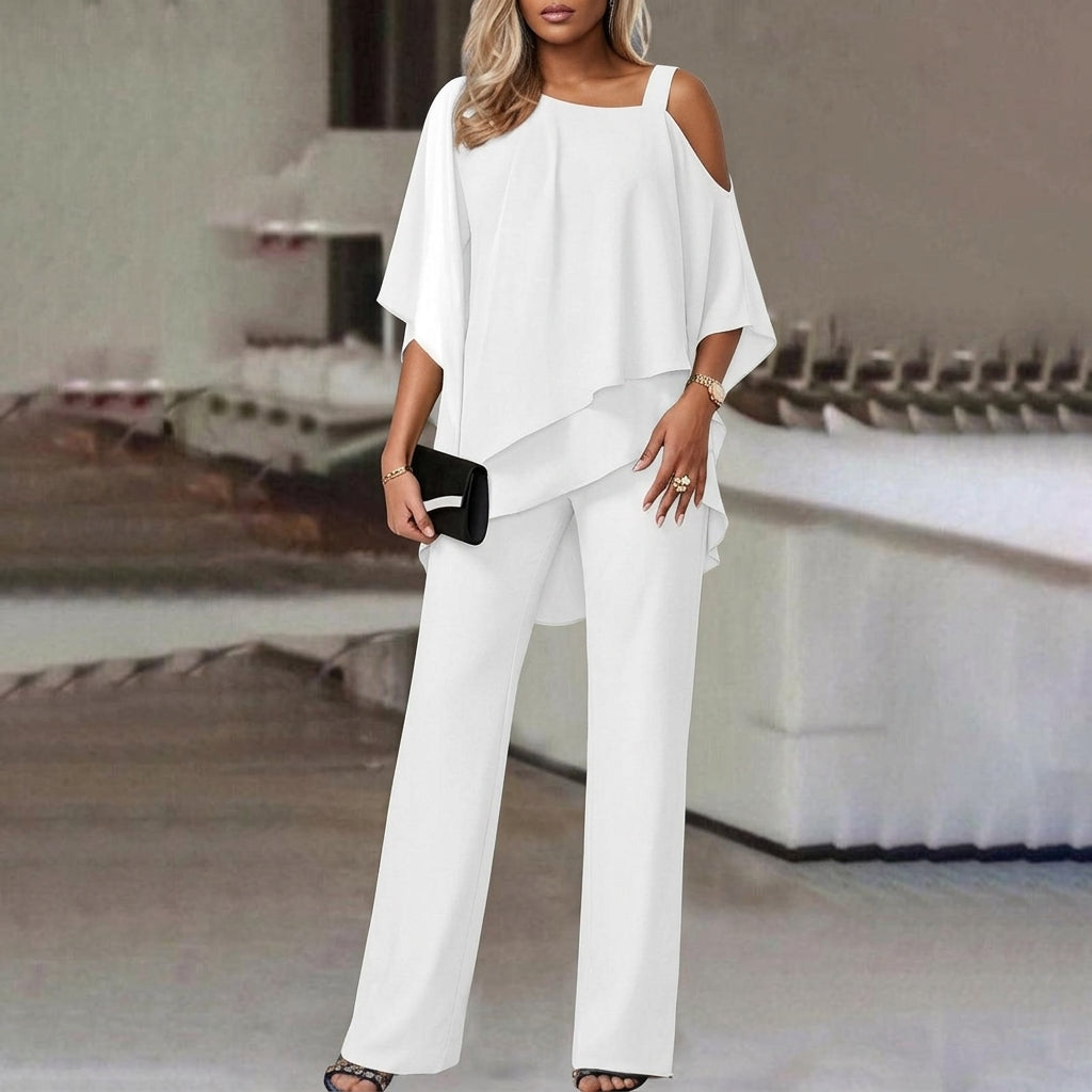 Chic women's two-piece pant set featuring an elegant asymmetric top and comfortable straight leg pants.