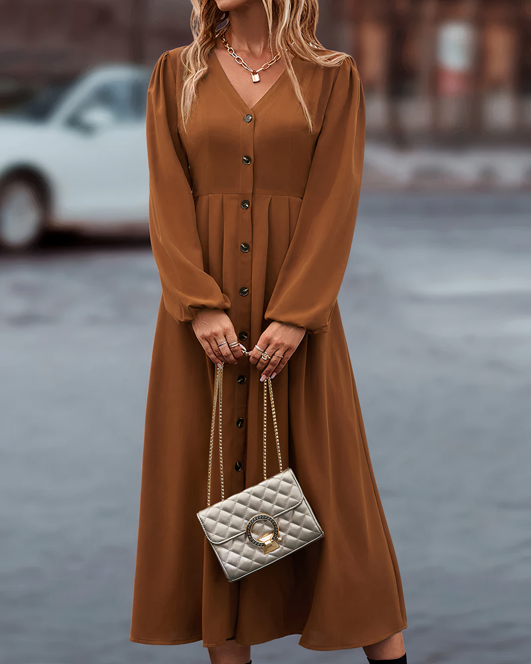 Women's elegant autumn maxi dress with long sleeves, V-neck, and stylish button closure for fall fashion.
