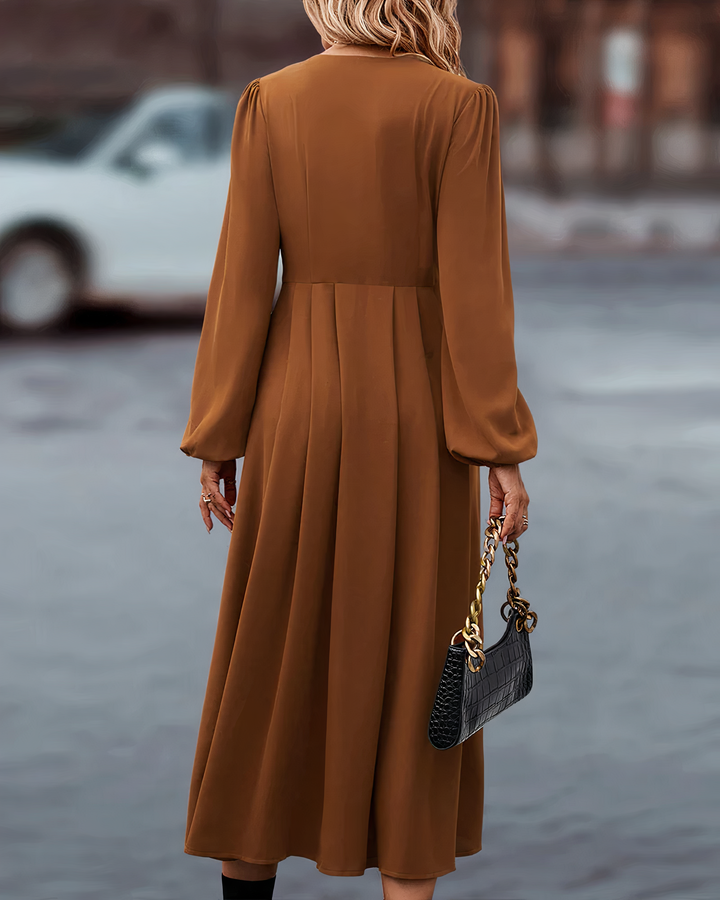 Elegant women's autumn maxi dress featuring full-length button closure, long sleeves & V-neck for chic fall style.