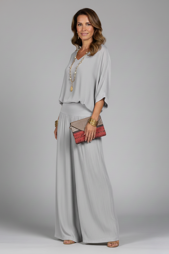 Women's elegant two-piece outfit featuring a batwing sleeve top and comfortable wide leg fashion pants.