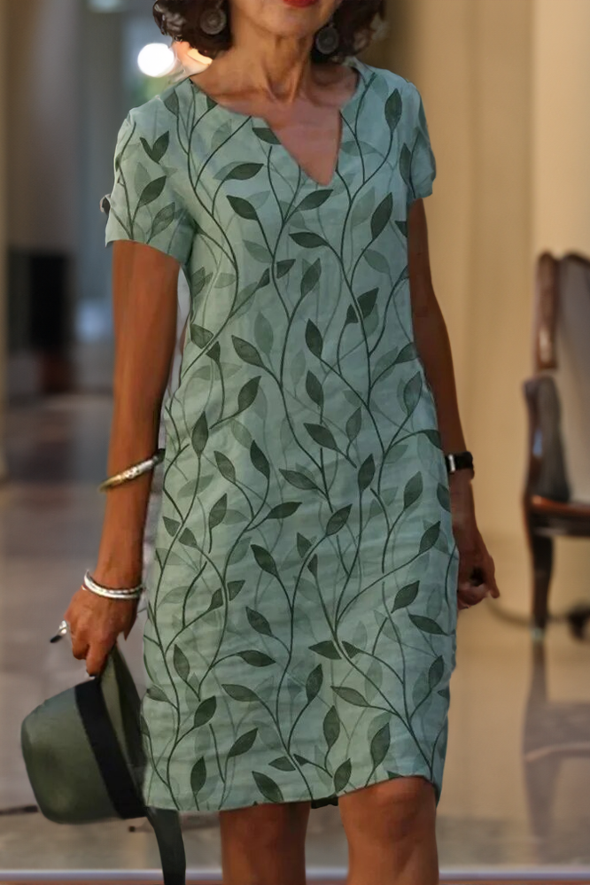 Sophisticated green midi dress for women, featuring a flattering belt. Ideal for parties & elegant events.
