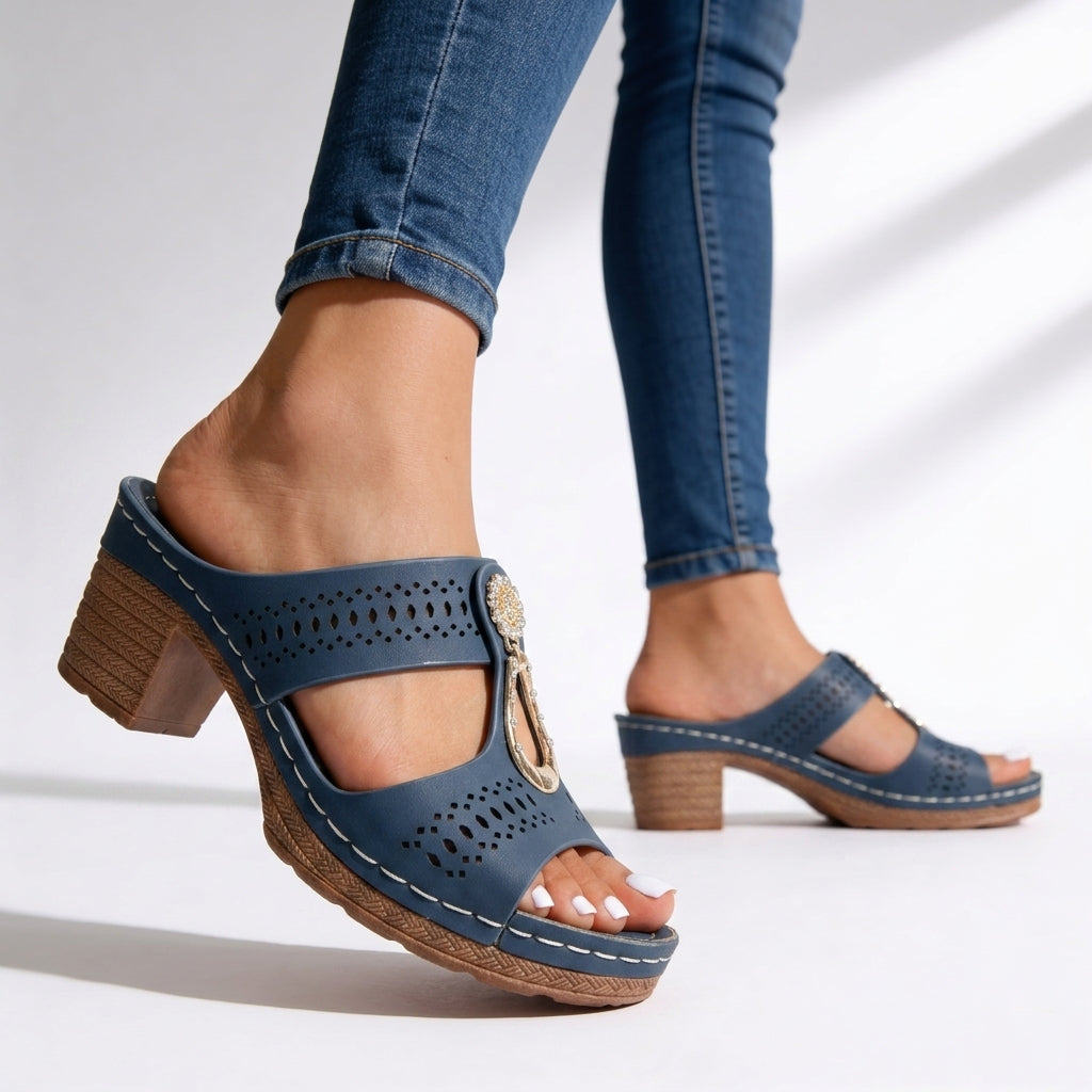 Cushioned women's slip-on block heel sandals featuring a chic rhinestone T-strap. Ideal for walking & events.