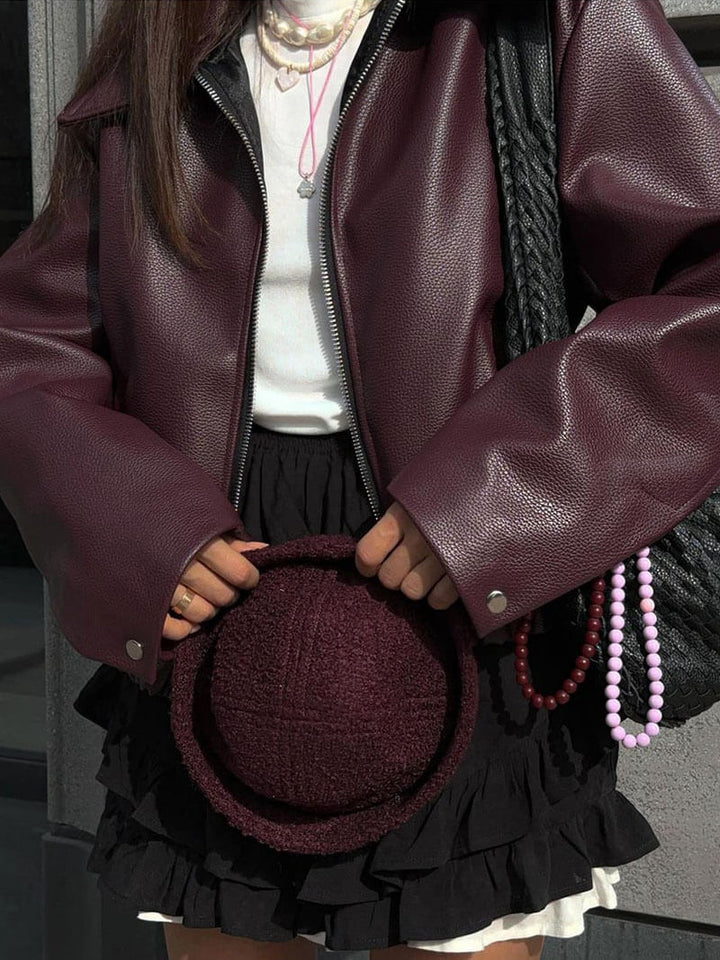 Chic women's burgundy zipper jacket. Modern design for elegant autumn fashion. Perfect for a tailored ladies' look.