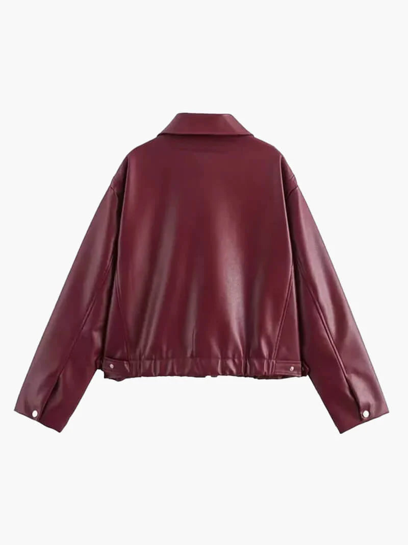 Modern women's burgundy leather jacket with zipper closure. Tailored fit for a versatile & chic ladies' fashion statement.