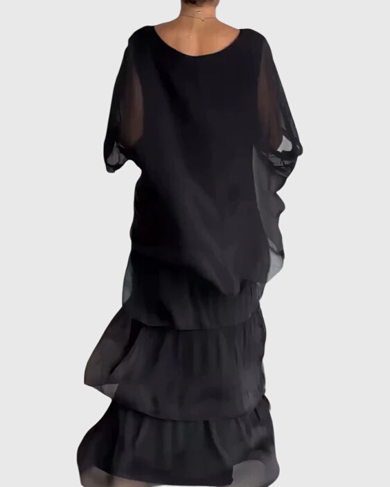 Flowing maxi dress with half sleeves, ideal for spring/summer formal occasions.