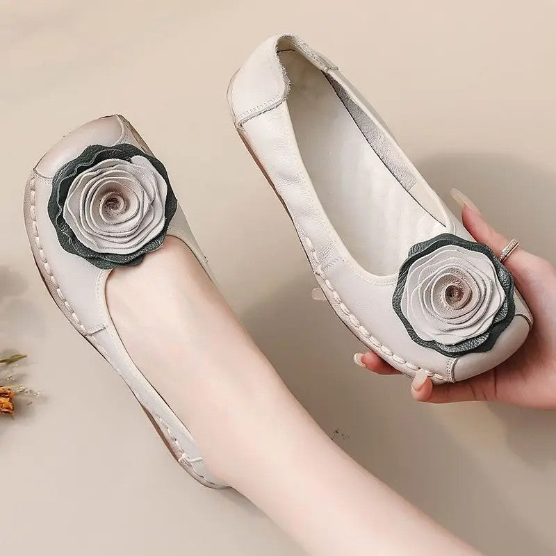 Stylish women's comfort loafers, slip-on design with charming floral appliqué.