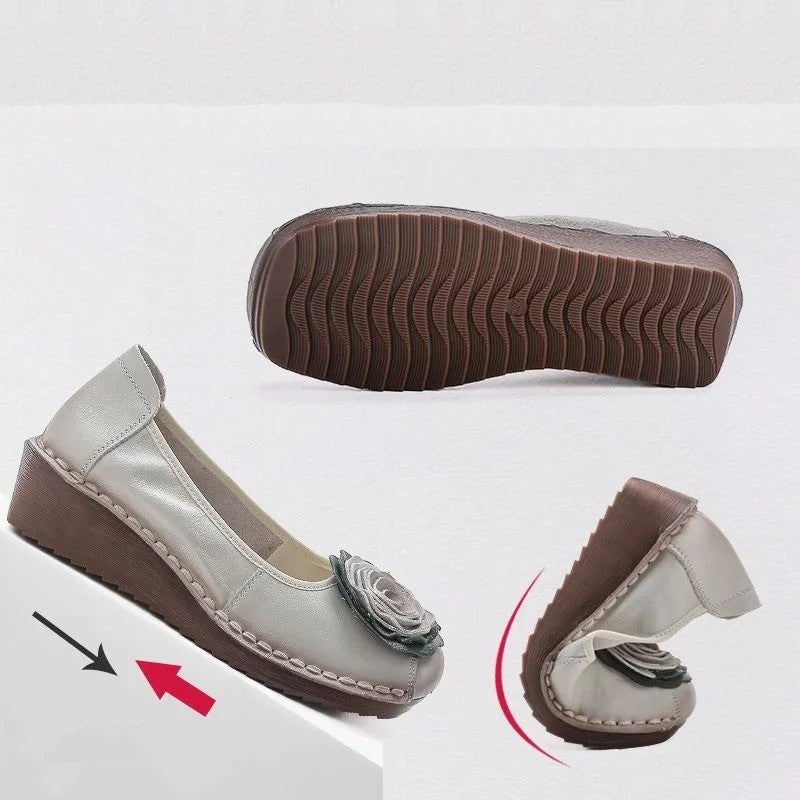 Women's casual loafers, featuring a lovely floral appliqué and easy slip-on style.