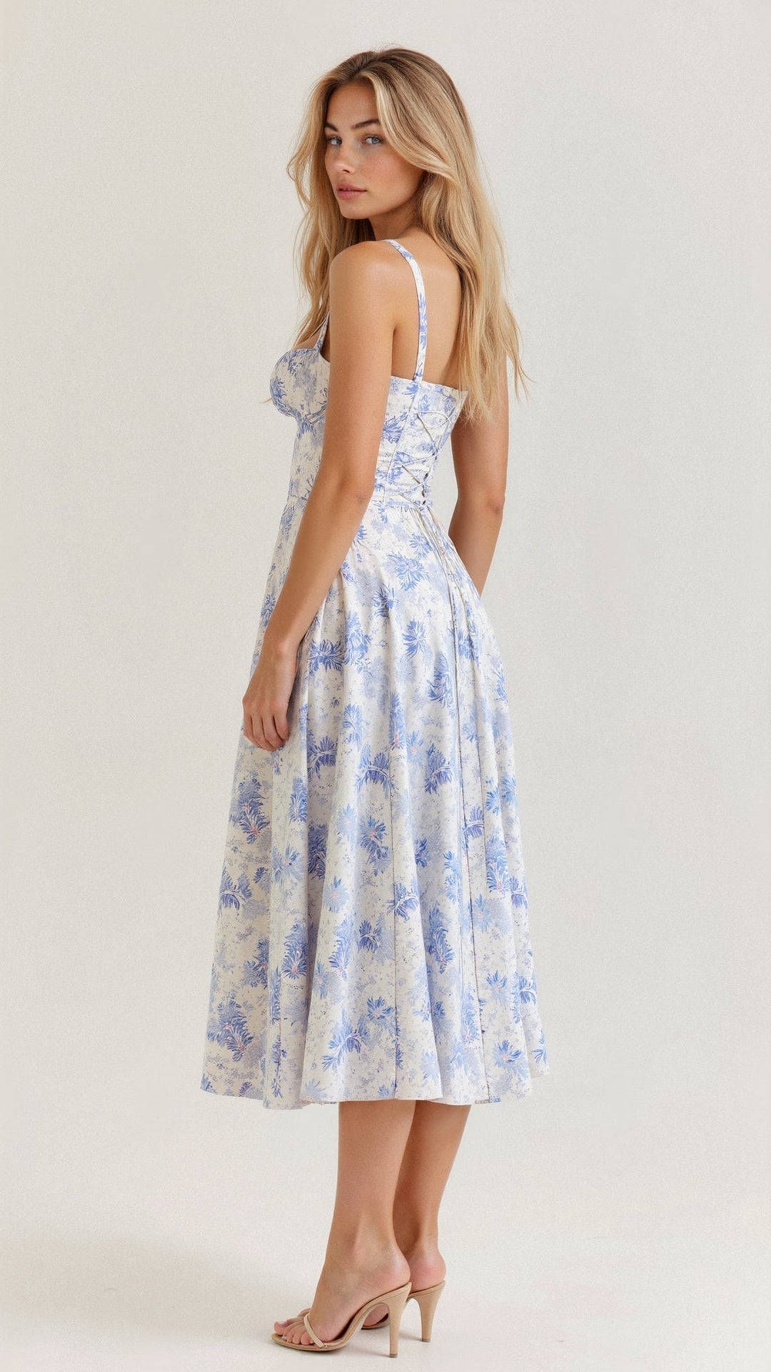 Elegant sleeveless women's floral midi dress, designed with a corset and a stylish side slit.